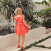 US stockist of Lacey Lane's cotton Melanie Bib dress in soft watermelon red.
