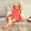 US stockist of Lacey Lane's cotton Melanie Bib dress in soft watermelon red.
