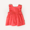 US stockist of Lacey Lane's cotton Melanie Bib dress in soft watermelon red.