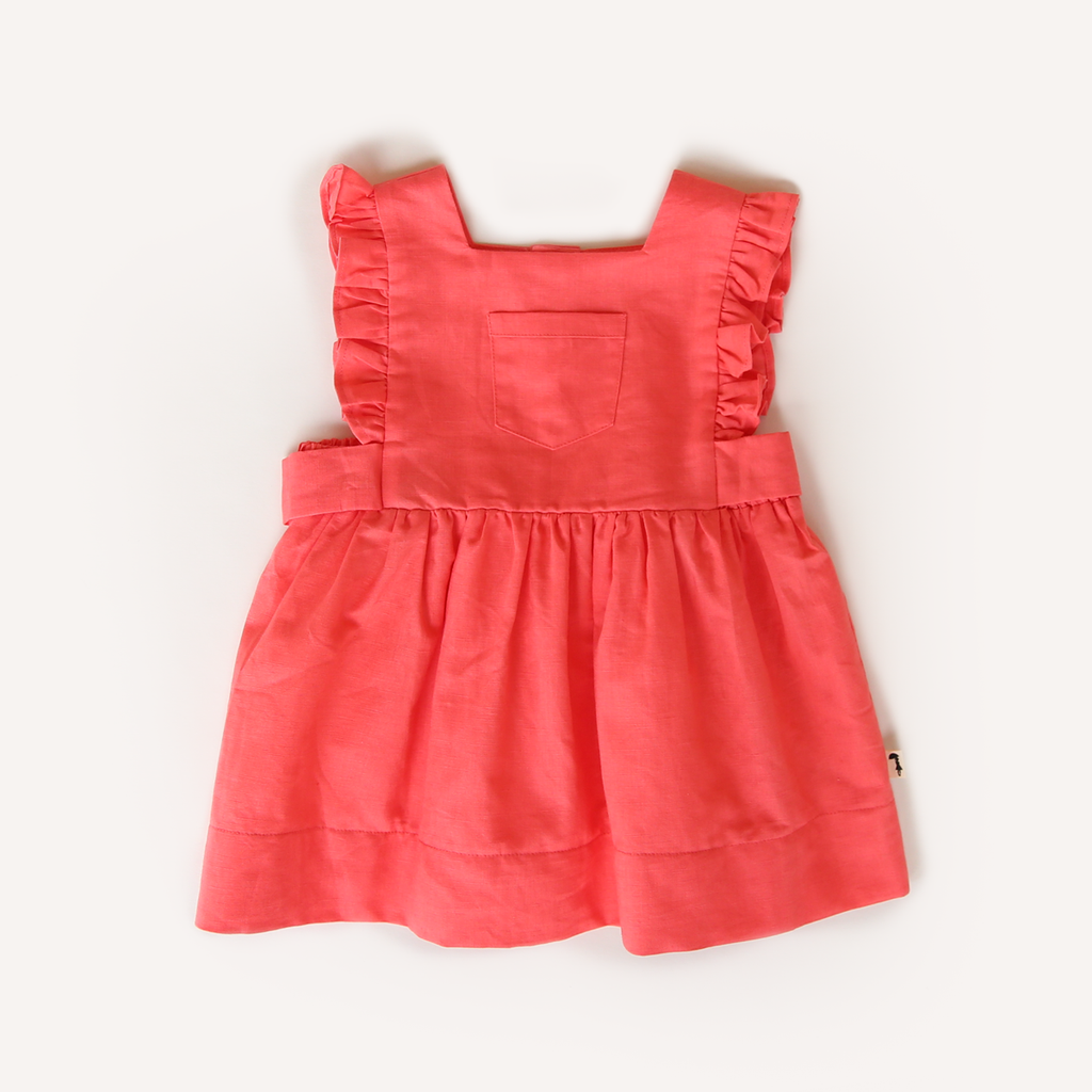 US stockist of Lacey Lane's cotton Melanie Bib dress in soft watermelon red.