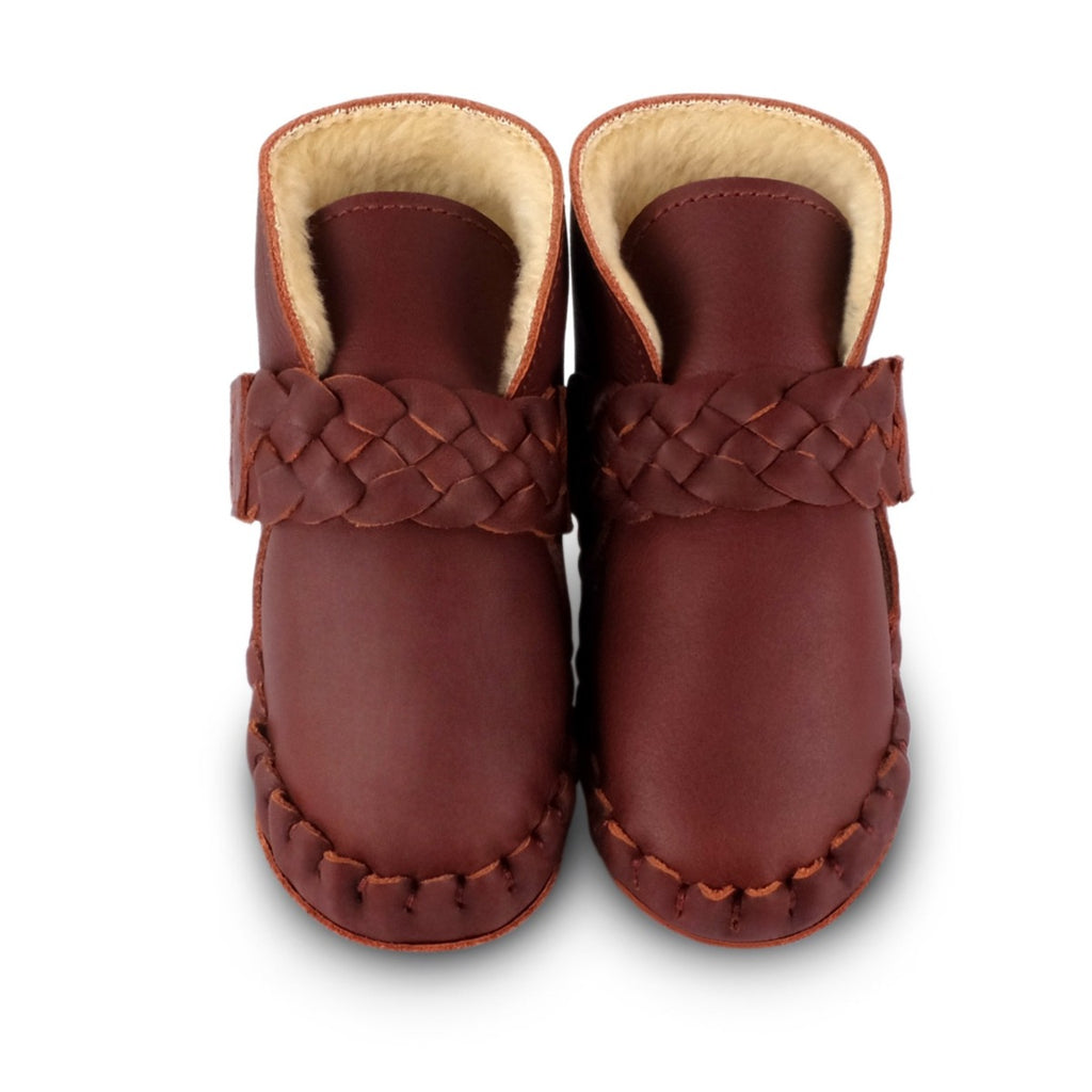 US stockist of Donsje's Burgundy classic leather  baby shoes with Mace faux fur lining.  Velcro braided fastening - soft sole under 12mths.