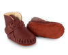 US stockist of Donsje's Burgundy classic leather  baby shoes with Mace faux fur lining.  Velcro braided fastening - soft sole under 12mths.