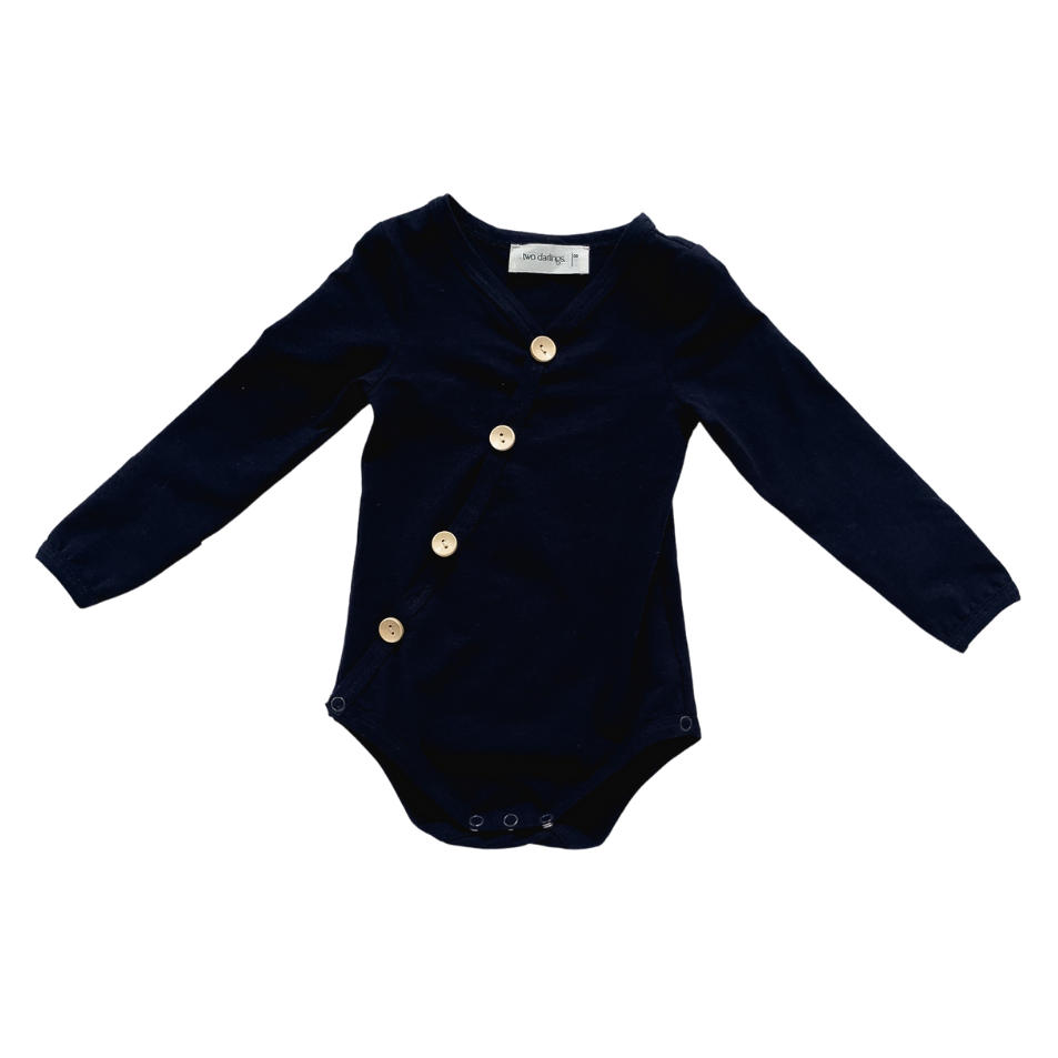 US stockist of Two Darling's long sleeve bamboo/cotton midnight blue bodysuit. Kimono style crossover front with four functioning wooden buttons.  Snaps at crotch.
