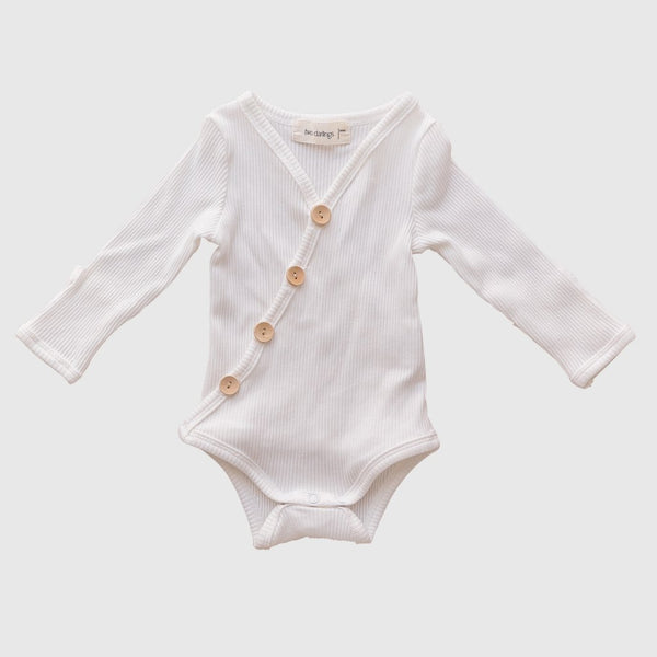 US stockist of Two Darlings gender neutral Milk stretch rib cotton bodysuit. Long Sleeves with 4 non functional wooden buttons kimono style across the front.