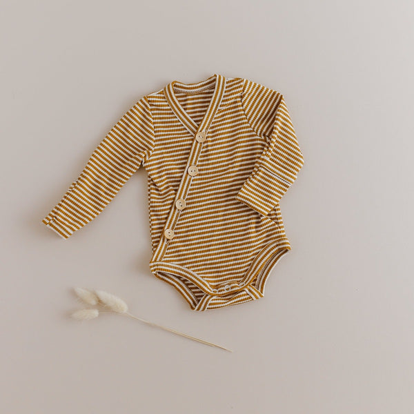 US stockist of Two Darlings gender neutral Mustard Stripe stretch rib cotton bodysuit. Long Sleeves with 4 non functional wooden buttons kimono style across the front.