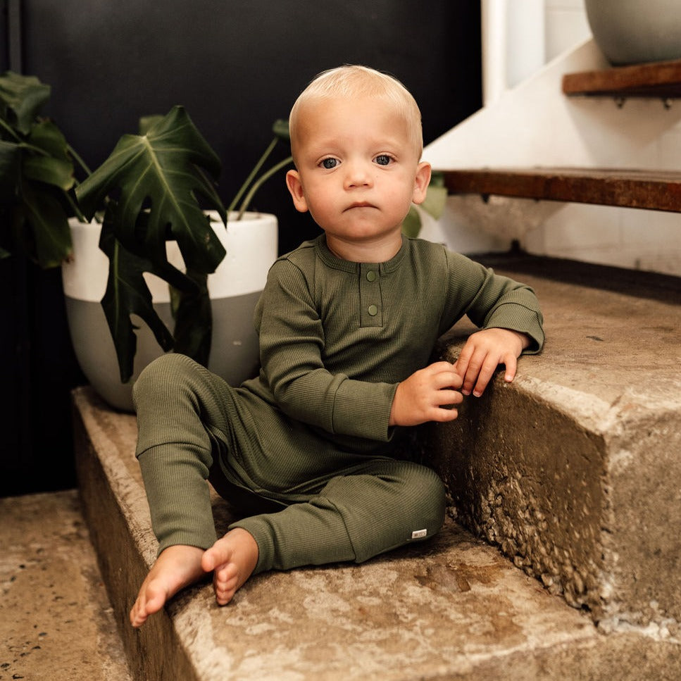 US stockist of Snuggle Hunny Kid's organic jersey Olive zip growsuit.