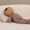 US stockist of Olli Ella's gender neutral, Pip Dozy Dinkum.  Features tuft of brown hair with non removable hooded light purple onesie.