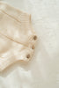 US stockist of Illoura the Label's gender neutral Tallow Romper in Vanilla.