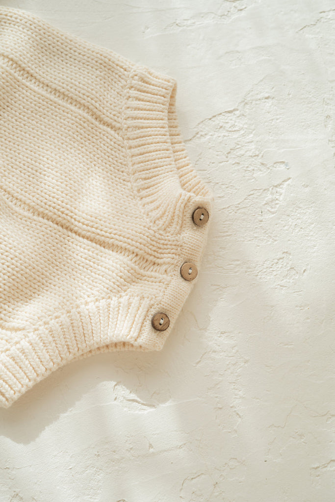 US stockist of Illoura the Label's gender neutral Tallow Romper in Vanilla.
