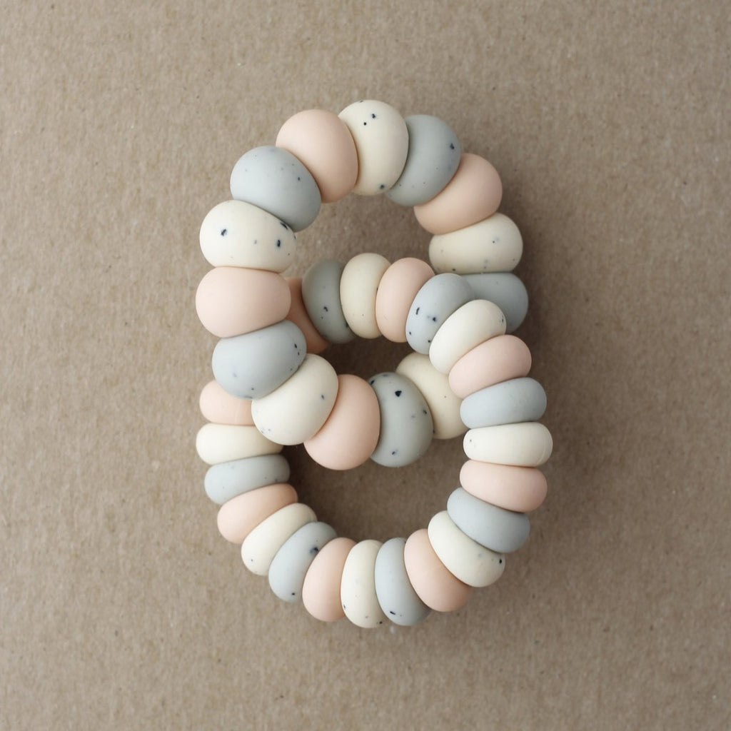 US stockist of Little Chew's gender neutral Multi Luna silicone double freezer teether in peach.