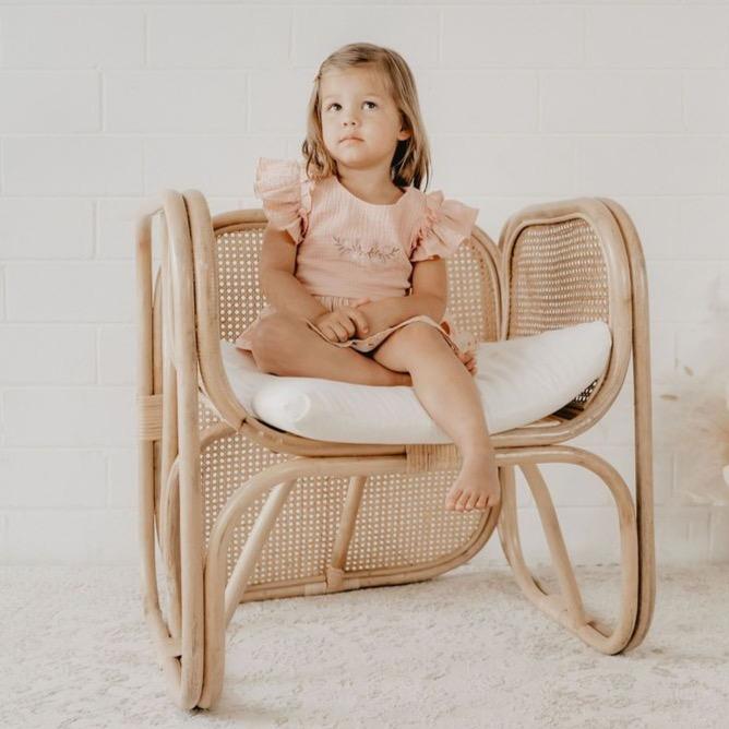 US stockist of India and Grace's Embroidered Ruffle Peplum Top in vintage pink.  Made from cotton with shell buttons at the back, ruffle sleeves and floral embroidery on the chest. 
