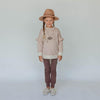 US stockist of Buck & Baa's gender neutral, organic cotton plum leggings.  Features elastic waist and functional drawstring.