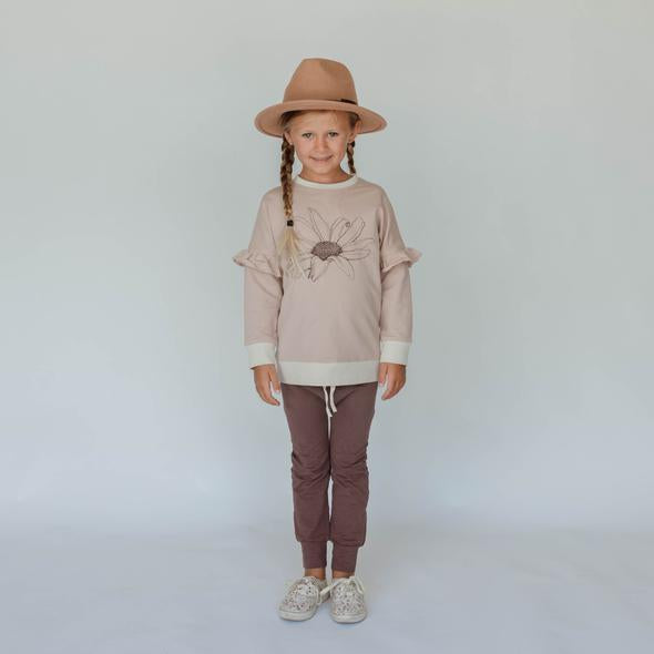 US stockist of Buck & Baa's gender neutral, organic cotton plum leggings.  Features elastic waist and functional drawstring.