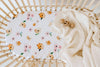 US stockist of Snuggle Hunny Kid's Poppy stretch cotton jersey bassinet sheet. White color with pink and yellow poppy print.