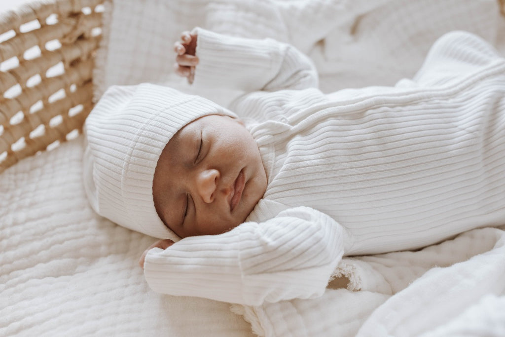 US stockist of Buck & Baa's organic cotton rib zip romper in gender neutral Milk.  