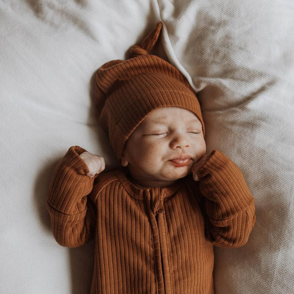US stockist of Buck & Baa's gender neutral, organic cotton ribbed knotted hat in Cinnamon.