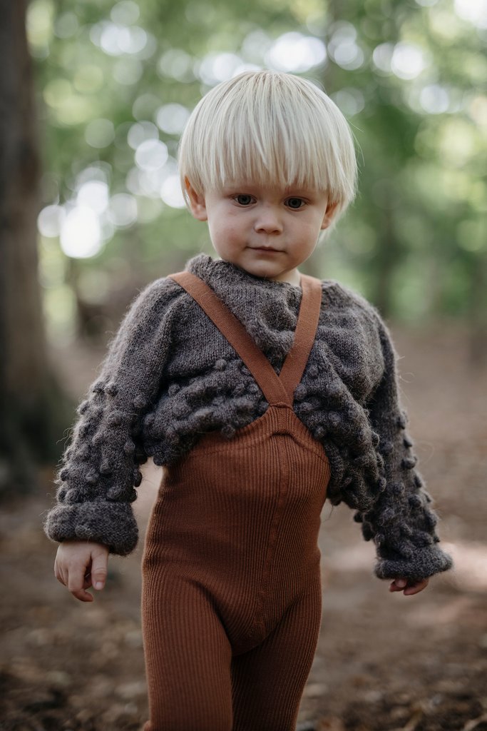 US stockist of Silly Silas gender neutral retro ribbed footed tights in cinnamon.  Made from 100% cotton and features braces.