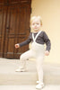 US stockist of Silly Silas gender neutral retro ribbed footed tights in cream blend.  Made from 100% cotton and features braces.