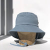US stockist of Fini the Label's gender neutral, sailor swim hat in heaven. Features elongated back for added sun protection, wide brim and chin strap. Brim is medium stiffness and can be flipped up at front. Sides can be worn buttoned up for that sailor look.  Made from nylon/spandex and is quick drying.