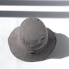 US stockist of Fini the Label's gender neutral, sailor swim hat in mushroom. Features elongated back for added sun protection, wide brim and chin strap. Brim is medium stiffness and can be flipped up at front. Sides can be worn buttoned up for that sailor look.  Made from nylon/spandex and is quick drying.