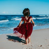 US stockist of Karibou Kid's Scarlett Tutu Dress.  Made from a soft cotton blend with midi length tulle skirt.  Features open back with a big bow.