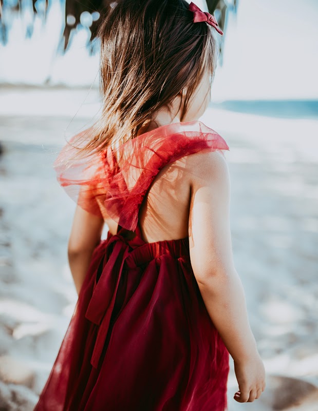 US stockist of Karibou Kid's Scarlett Tutu Dress.  Made from a soft cotton blend with midi length tulle skirt.  Features open back with a big bow.