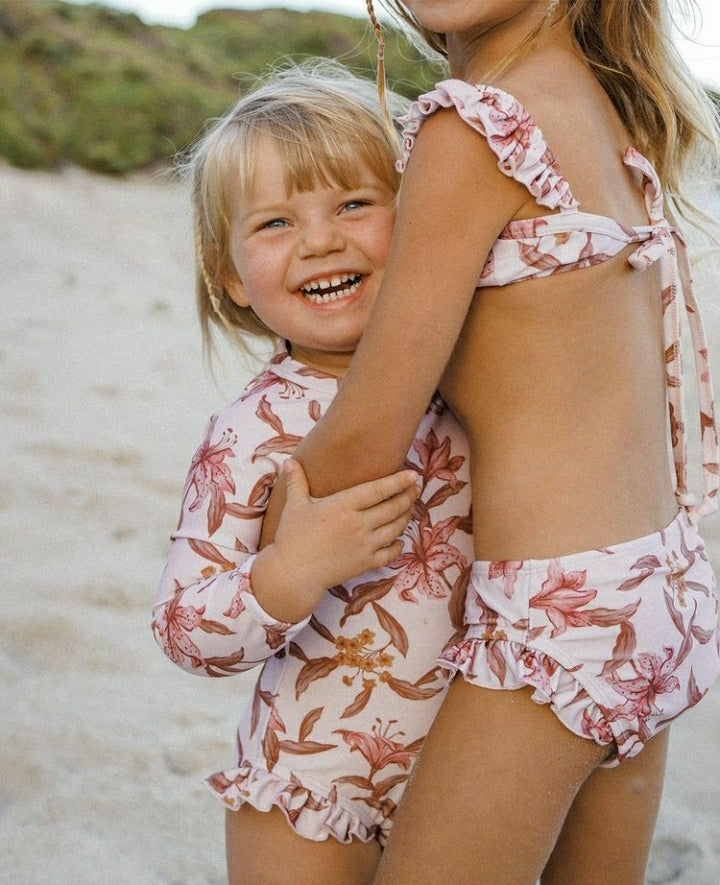 US stockist of Sukoo the Label's Harper Bikini in Dusty Floral.  Made from UPF 50 + Repreve fabric.  Crop top bikini top with ruffles at shoulder and high waisted bikini bottoms.