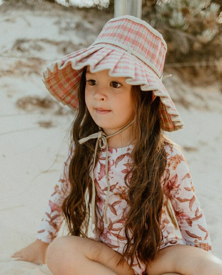 US stockist of Sukoo the Label.  Long Sleeve rashsuit made from Repreve UPF 50 + fabric.  Cream fabric with beautiful pink floral print and hidden zip at back.