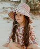US stockist of Sukoo the Label.  Long Sleeve rashsuit made from Repreve UPF 50 + fabric.  Cream fabric with beautiful pink floral print and hidden zip at back.