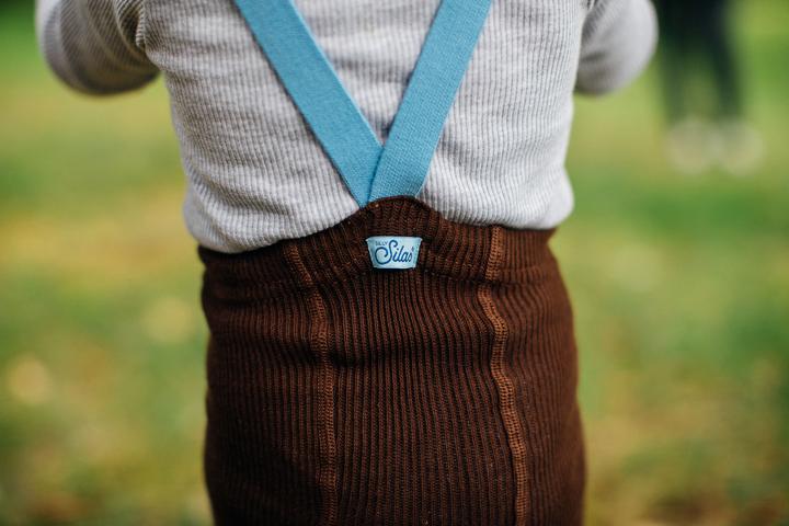 US stockist of Silly Silas gender neutral retro ribbed footed tights in brown.  Made from 100% cotton and featuring contrasting light blue braces.