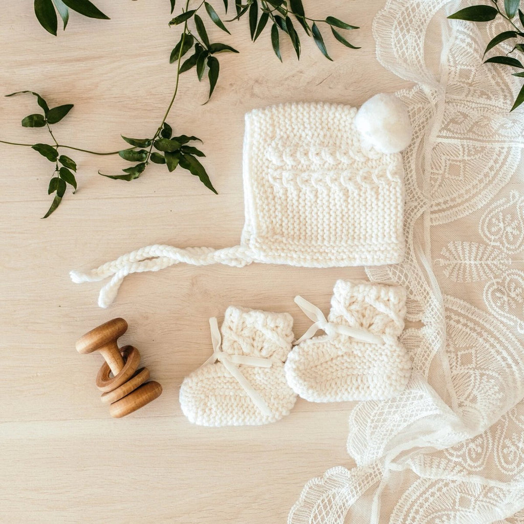 US stockist of Snuggle Hunny Kids ivory merino wool bonnet and bootie set