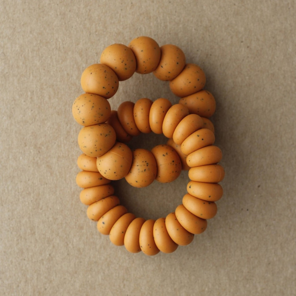 US stockist of Little Chew's gender neutral Luna silicone double freezer teether in speckled golden ochre