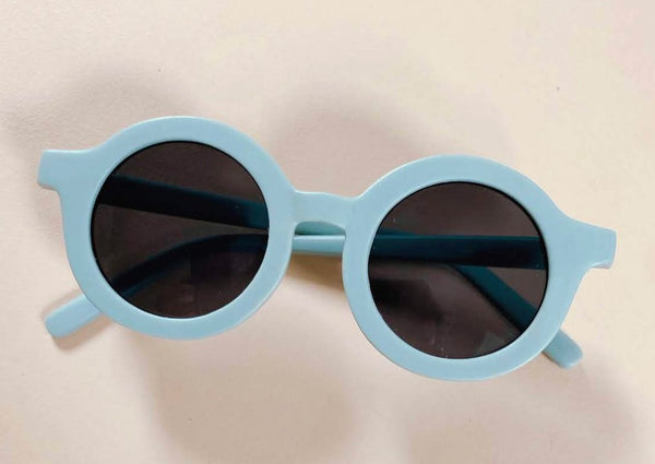US stockist of Grech & Co's gender neutral sustainable sunglasses.  Made from recycled plastic, with round grey lens with UV 400 protection in a light blue color.