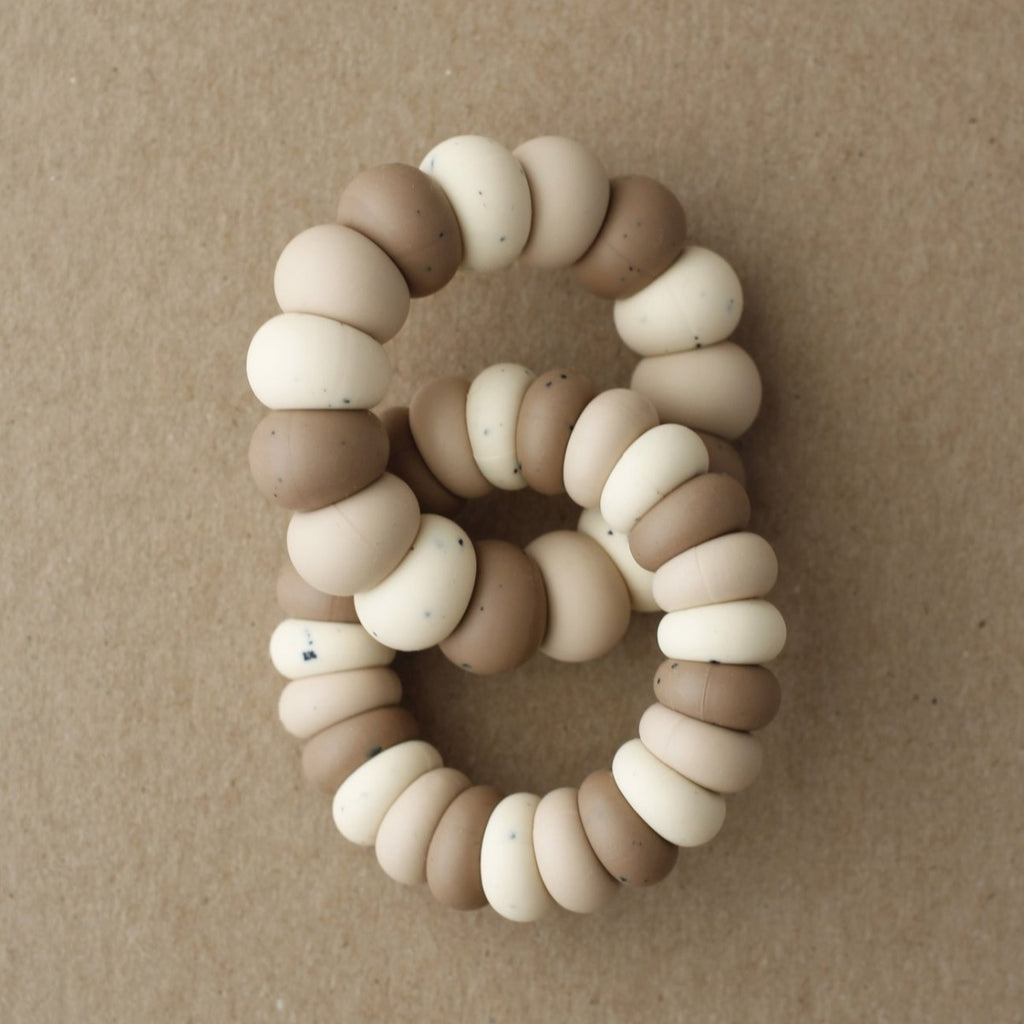 US stockist of Little Chew's gender neutral Multi Luna silicone double freezer teether in Truffle.