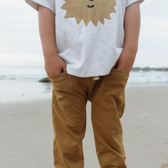 US stockist of Buck & Baa's gender neutral organic cotton tumeric pocket pants.  Features elastic waist with functional drawstring and two front pockets.