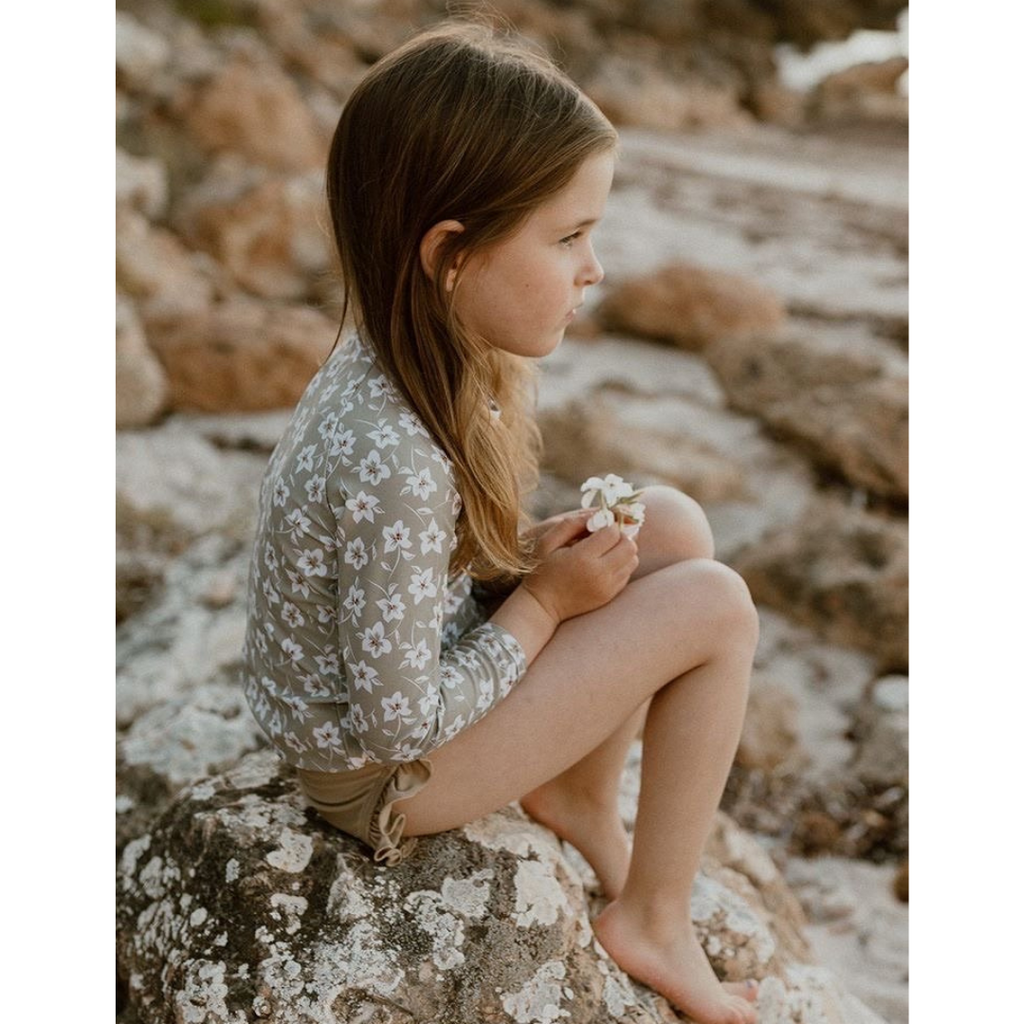 US stockist of Sukoo the Label's long sleeve Belle Rash Top. Made from UPF 50 + Repreve fabric with an all over floral print and invisible zip at back.  Pairs with frill bottoms, sold seperately.
