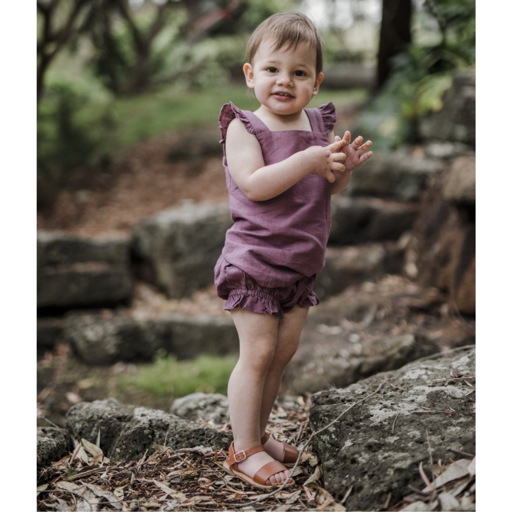 US stockist of Five O' Six's Jacquard Weave Frill Set in a deep plum color.  Made from organic linen.