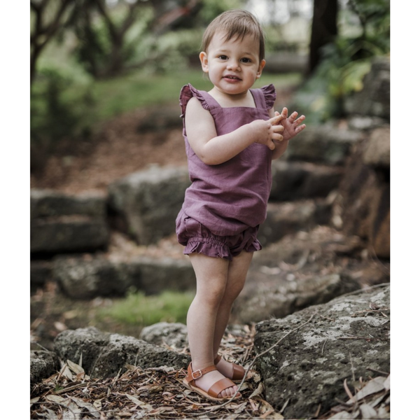 US stockist of Five O' Six's Jacquard Weave Frill Set in a deep plum color.  Made from organic linen.