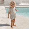 US stockist of Illoura the Label's Wren Rashsuit in Pale Khaki.  Made from UPF 50, Econyl fabric.