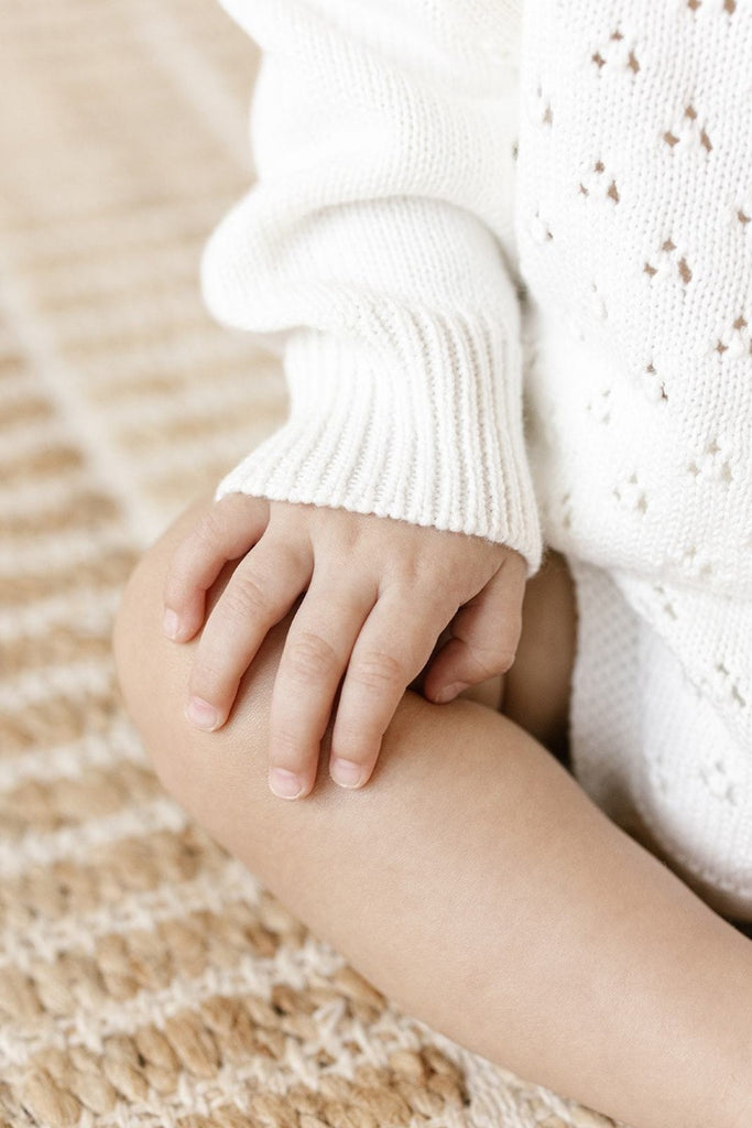 US stockist of Two Darling's long sleeve, Milk knit romper.