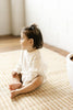 US stockist of Two Darling's long sleeve, Milk knit romper.