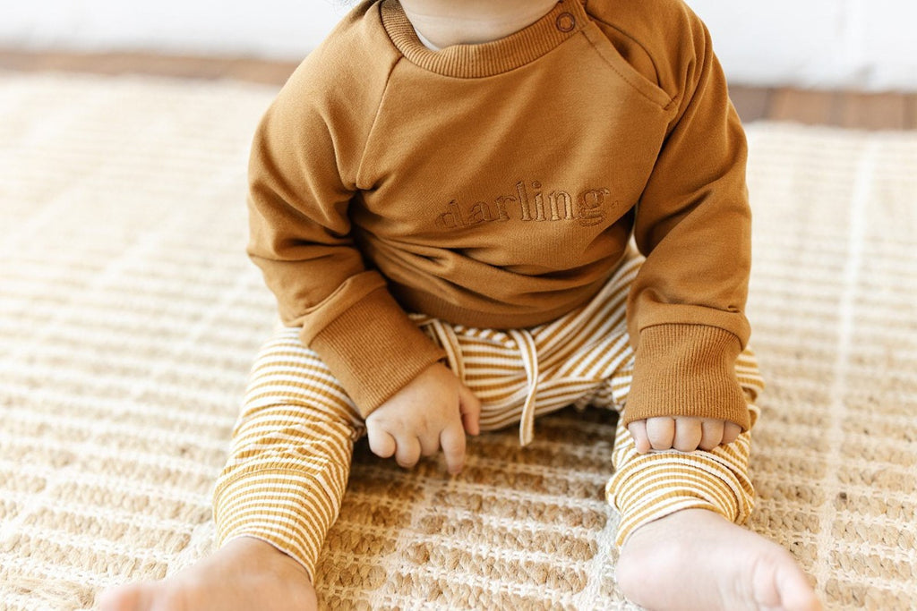US stockist of Two Darling's cotton "Darling" sweatshirt in rust.