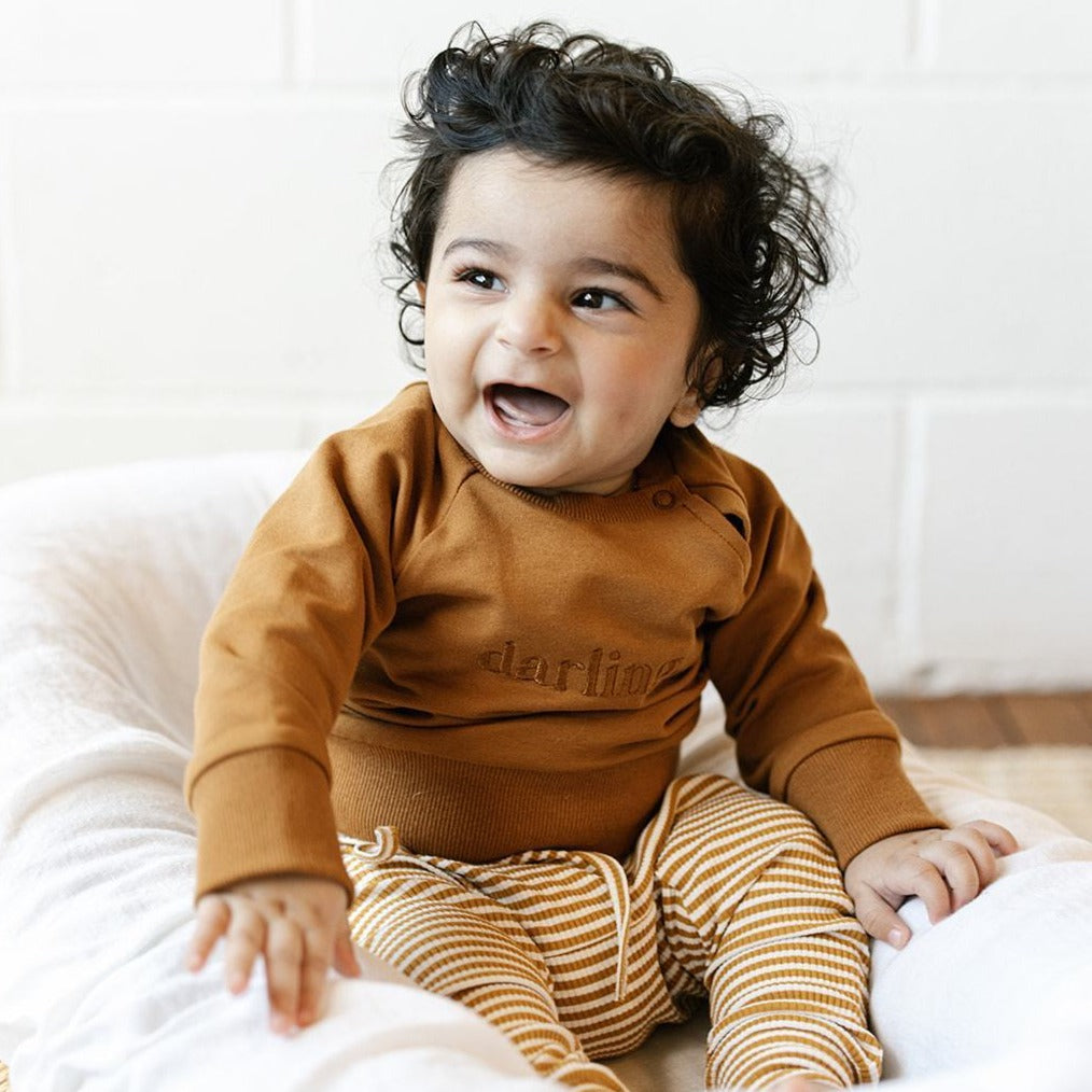 US stockist of Two Darling's cotton "Darling" sweatshirt in rust.
