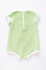 The US stockist of Zulu & Zephyr Mini Rib Onesie in Marine.  A loose fit gender neutral style made from sustainable ECONYL UPF 50+ fabric.  Short sleeved with contrasing back zipper and binds.  Fully lined.