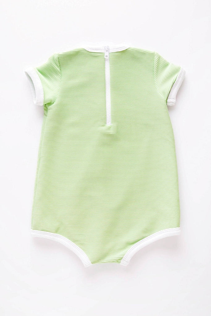 The US stockist of Zulu & Zephyr Mini Rib Onesie in Marine.  A loose fit gender neutral style made from sustainable ECONYL UPF 50+ fabric.  Short sleeved with contrasing back zipper and binds.  Fully lined.
