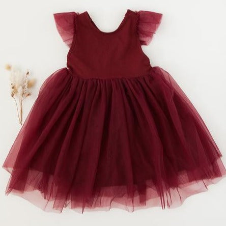 US stockist of Karibou Kid's Scarlett Tutu Dress.  Made from a soft cotton blend with midi length tulle skirt.  Features open back with a big bow.