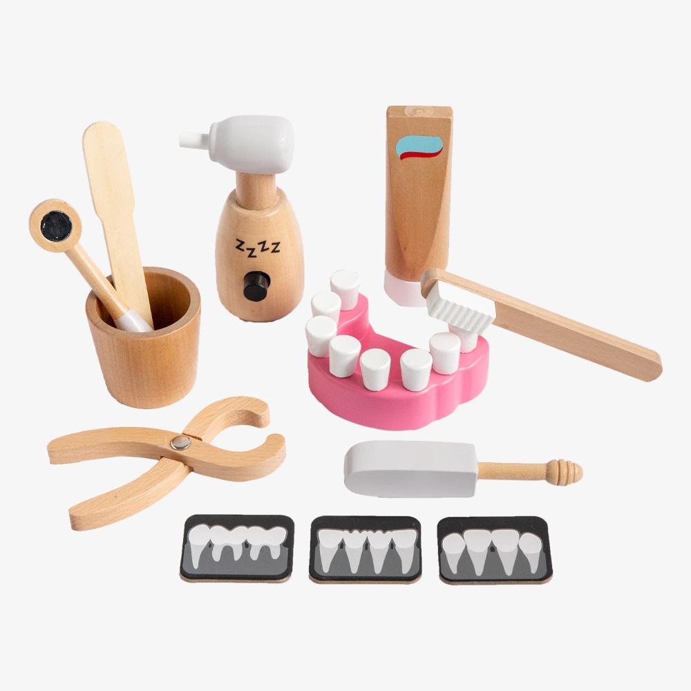 US stockist of Make Me Iconic's 12 piece wooden pretend play dentist kit.  Contains a mouth model, x rays, toothpaster, drill and more.