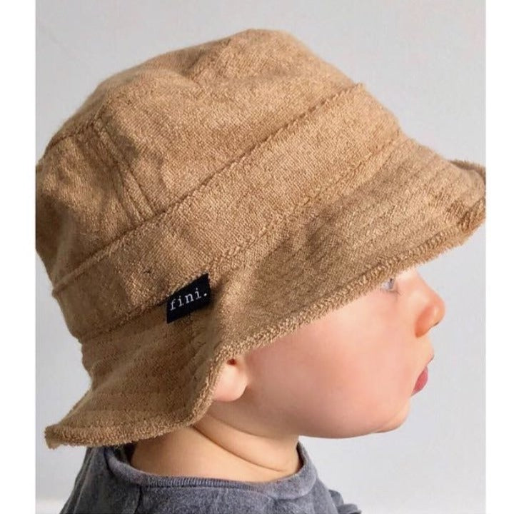US stockist of Fini the Label's tan bucket hat made from soft terry towelling fabric.