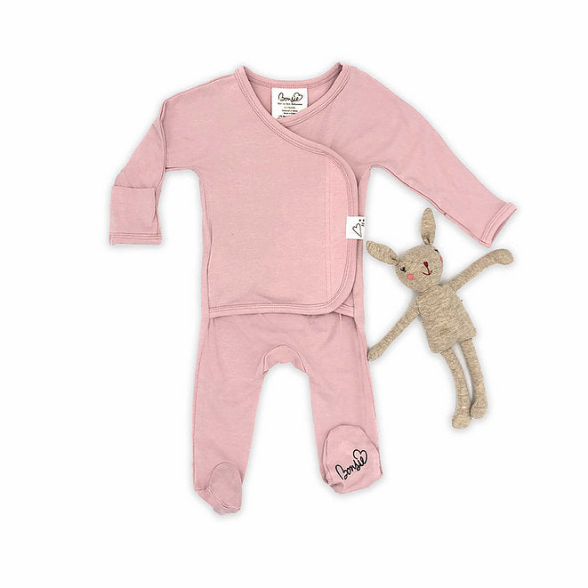 Stockist of Bonsie's rayon blend Peony pink footie.  Top section has velcro wrap body which can be undone for skin to skin contact.  Elastic waist that can be pulled down for easy diaper changes. 