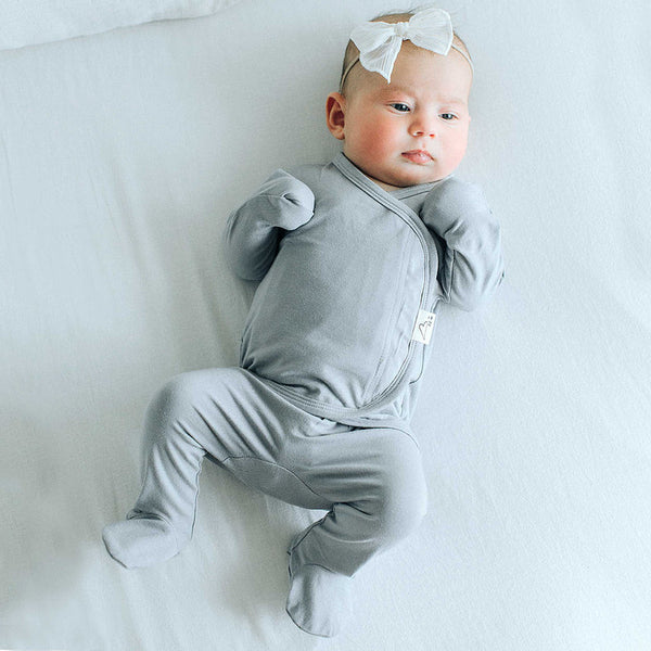 Stockist of Bonsie's rayon blend fog grey footie.  Top section has velcro wrap body which can be undone for skin to skin contact.  Elastic waist that can be pulled down for easy diaper changes. 